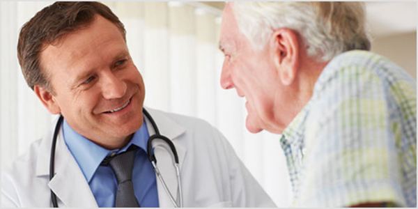 Old man talking with doctor