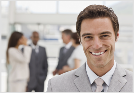 guy in grey suit smiling